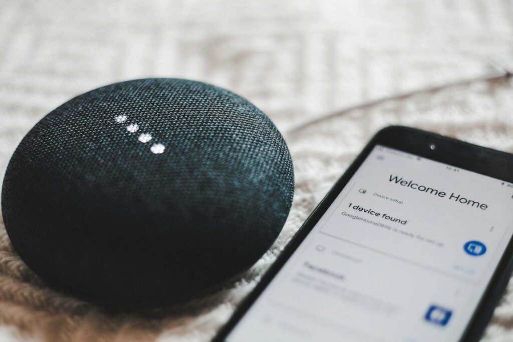 AI search optimisation services – voice search assistant on charcoal smart speaker and smartphone for AI search optimisation