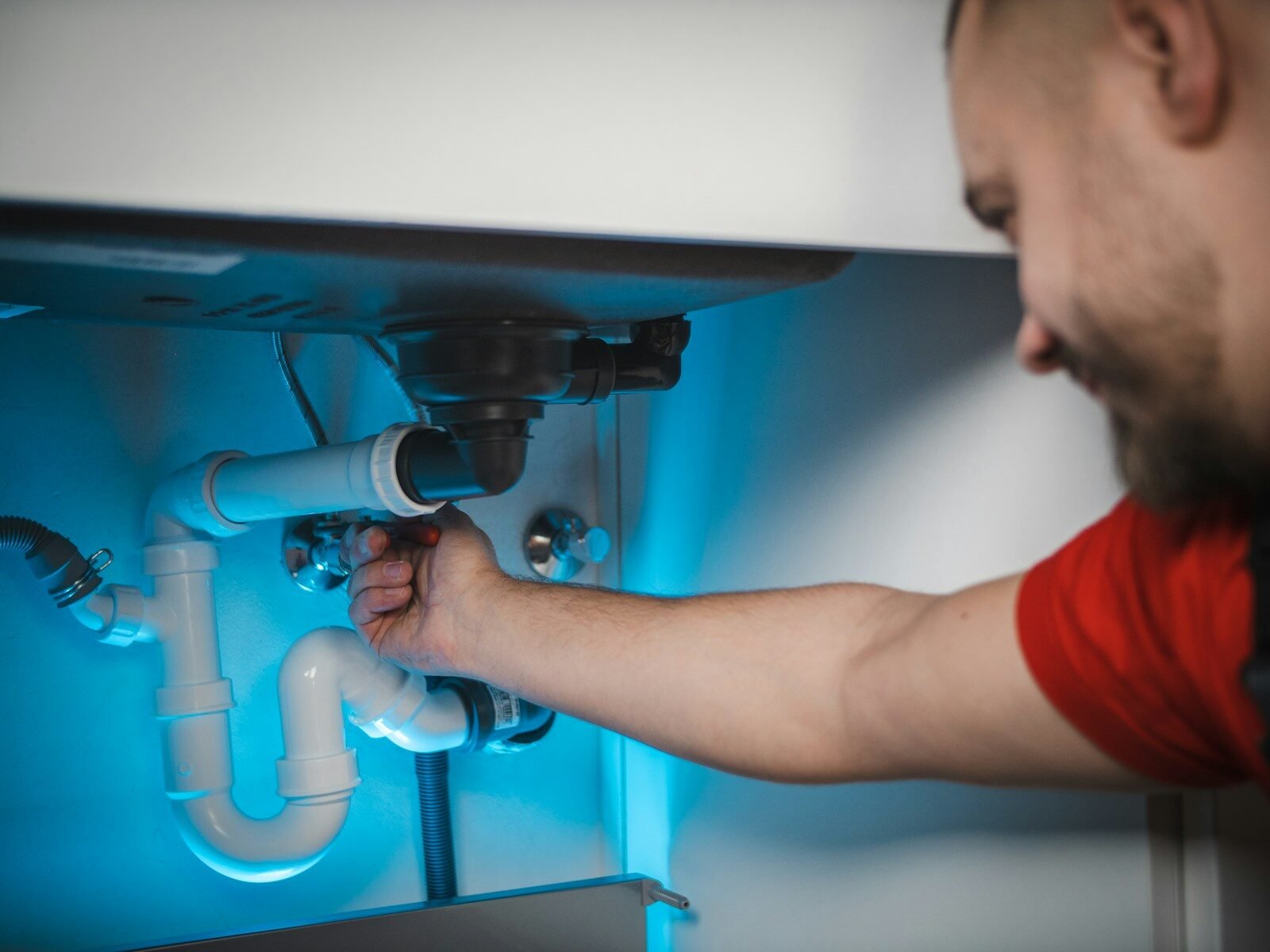 Plumber fixing pipe in Brisbane