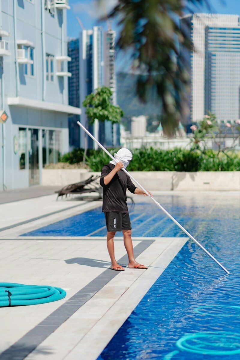 Man cleaning swimming pool in Perth